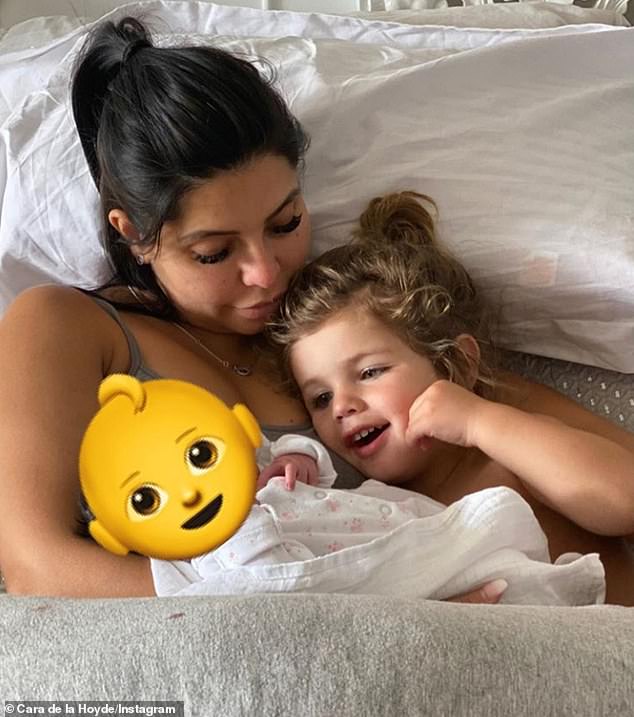 Bonding: On Wednesday, she shared a heartwarming snap of her son Freddie, two, bonding with his sister as he enjoyed his first full day as a big brother