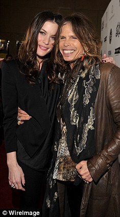 Close: The tall beauty brought her  Aerosmith rocker father, Steve Tyler to the première of her film Super on Monday night