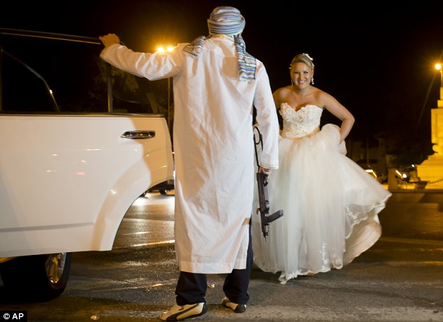 Romanian bride poses with mock kidnappers