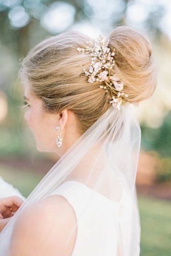 wedding bun hairstyles high bun on blonde hair woth gold accessories and veil richard photo lab